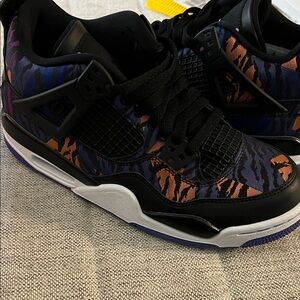 Jordan 4 “Black Rush Violet” Black and Orange Patterned Sneakers